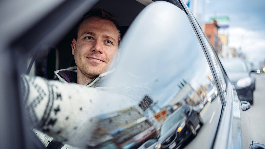 Man in a new leased car