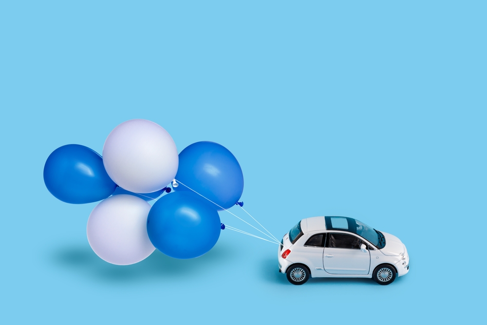 Small car with balloons over it