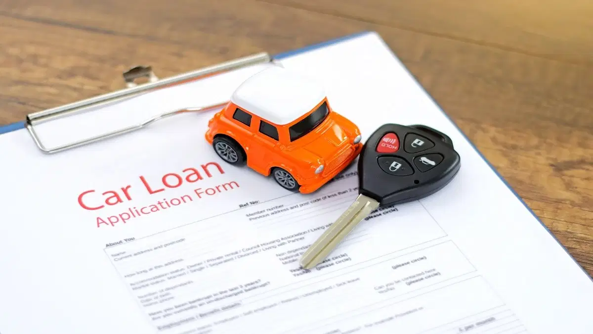 Car loan application form and car keys.