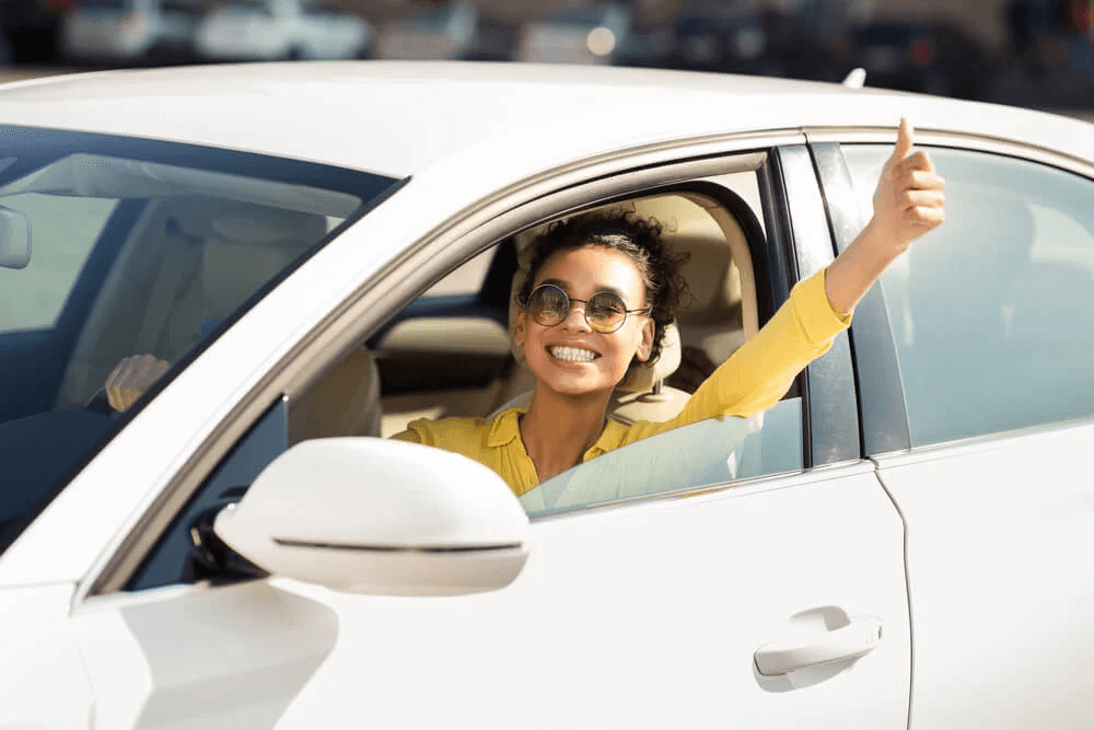 A woman drives her newly financed car in California.