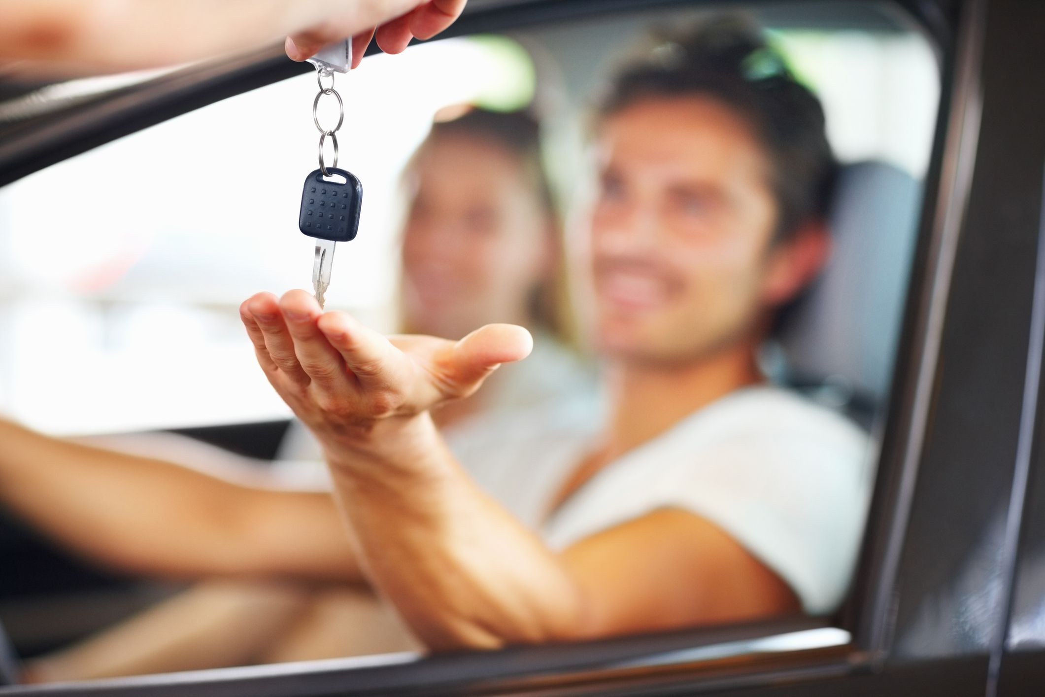Happy woman just bought a car in Connecticut.